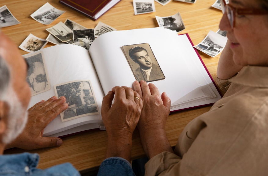 Older adults viewing old photos showing why every generation misses their childhood.