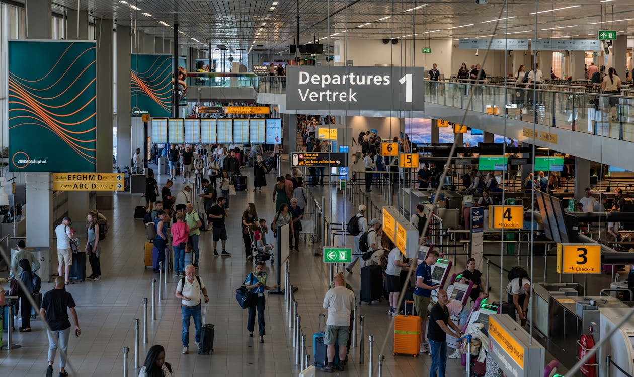 Busy departures hall showing why airports feel different.