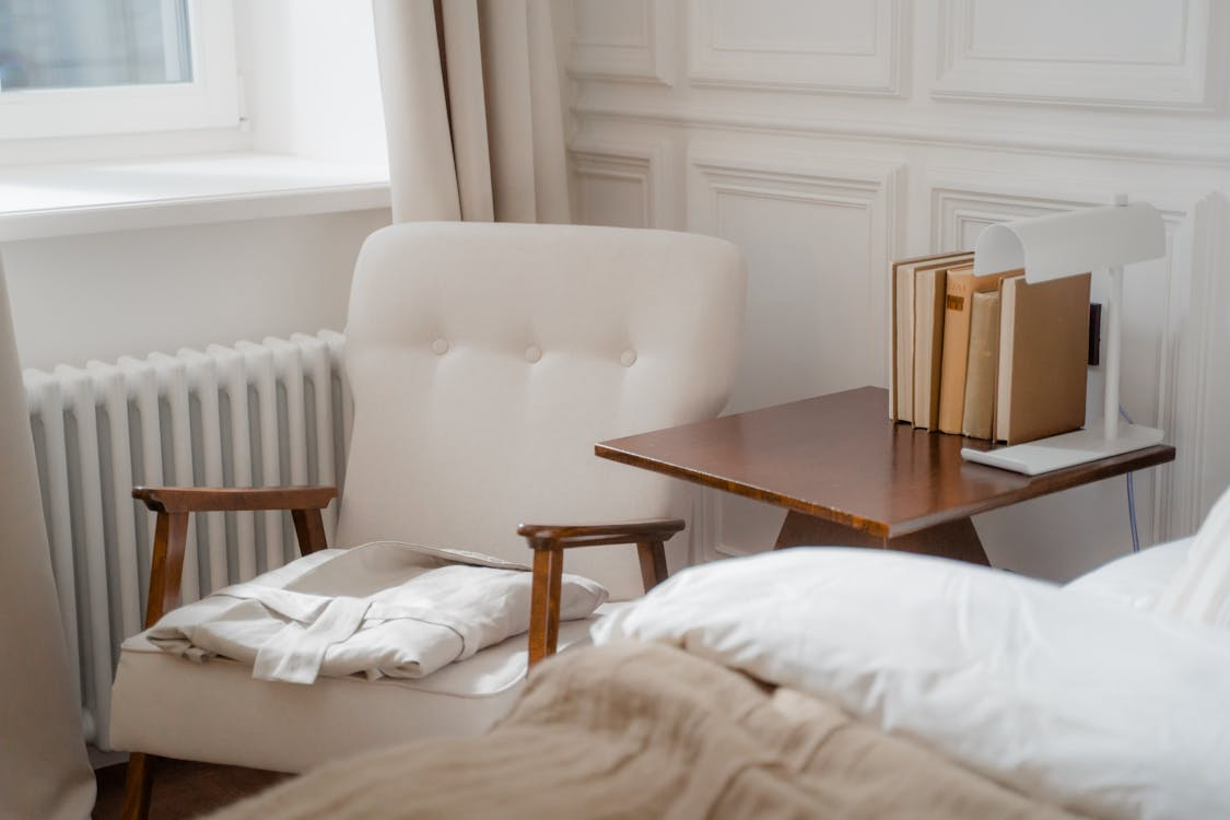 Soft bedroom corner showing why cozy spaces feel comforting.