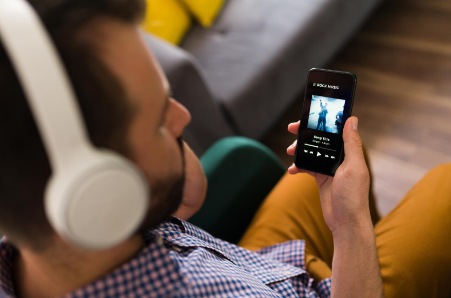 Man listening to music showing why songs get stuck in your head.
