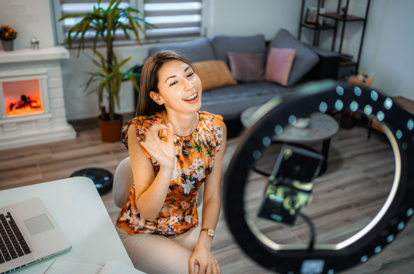 Woman filming content showing how the internet changed celebrity culture.